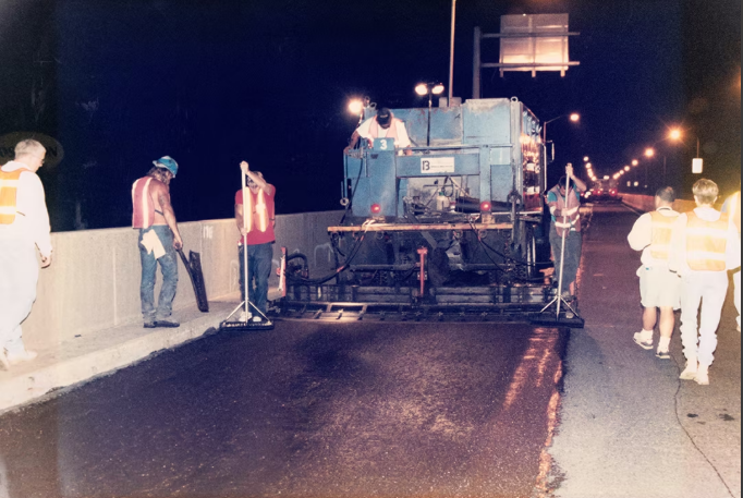 APS crew operating pavement preservation equipment
